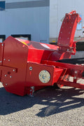 Extreme-duty red snow blower attachment for skid steer – front view

Hydraulic chute adjustment system on 84" snow blower model

72" skid steer snow blower attachment mounted for municipal use

Skid steer operator using snow blower in snowy mountain terrain

Rear hydraulic connection and chute control close-up on snow blower