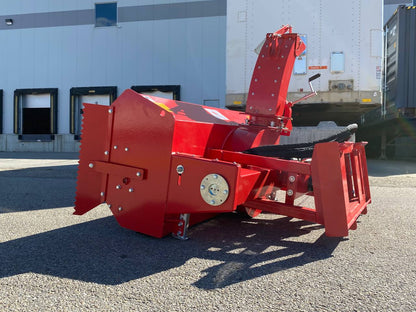 Extreme-duty red snow blower attachment for skid steer – front view

Hydraulic chute adjustment system on 84" snow blower model

72" skid steer snow blower attachment mounted for municipal use

Skid steer operator using snow blower in snowy mountain terrain

Rear hydraulic connection and chute control close-up on snow blower
