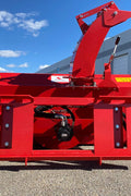 Extreme-duty red snow blower attachment for skid steer – front view

Hydraulic chute adjustment system on 84" snow blower model

72" skid steer snow blower attachment mounted for municipal use

Skid steer operator using snow blower in snowy mountain terrain

Rear hydraulic connection and chute control close-up on snow blower