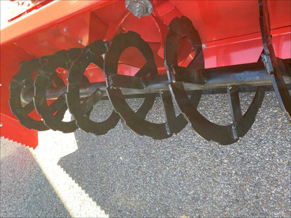 Extreme-duty red snow blower attachment for skid steer – front view

Hydraulic chute adjustment system on 84" snow blower model

72" skid steer snow blower attachment mounted for municipal use

Skid steer operator using snow blower in snowy mountain terrain

Rear hydraulic connection and chute control close-up on snow blower