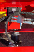 Extreme-duty red snow blower attachment for skid steer – front view

Hydraulic chute adjustment system on 84" snow blower model

72" skid steer snow blower attachment mounted for municipal use

Skid steer operator using snow blower in snowy mountain terrain

Rear hydraulic connection and chute control close-up on snow blower