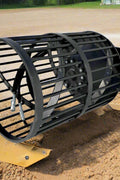 Hydraulic soil screening drum mounted on a skid steer
Rotating drum soil screener for landscaping
Rock screener attachment for clean topsoil
Close-up view of screening drum cage
Heavy-duty soil separation drum in action