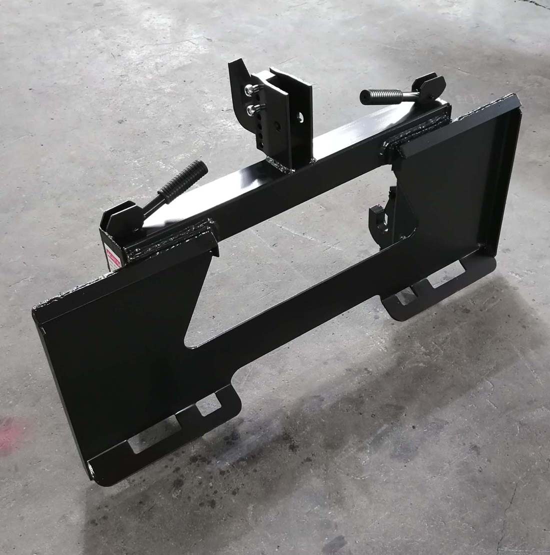 Skid Steer to 3-Point Hitch Adapter – Front View

Quick Attach Adapter Mounted on Loader

Universal 3-Point Adapter Frame – Side Angle

Heavy-Duty Steel Hitch Adapter – Rear View

