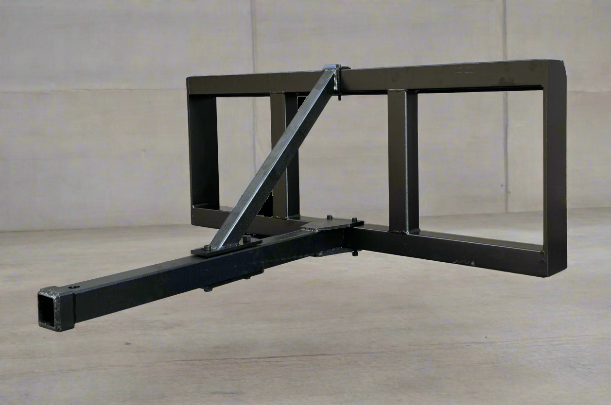 Skid steer trailer hitch attachment – front angled view
Hitch receiver close-up – Model 55763
Rear view of universal skid steer hitch
Trailer hitch mounted on skid steer