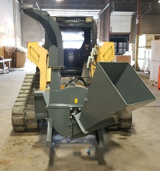 BX42 wood chipper attachment side view
Front-facing view of skid steer wood chipper BX42
Close-up of BX42 hydraulic chute and rotor
Rear view showing input hopper and feed
Mounted BX42 chipper on skid steer