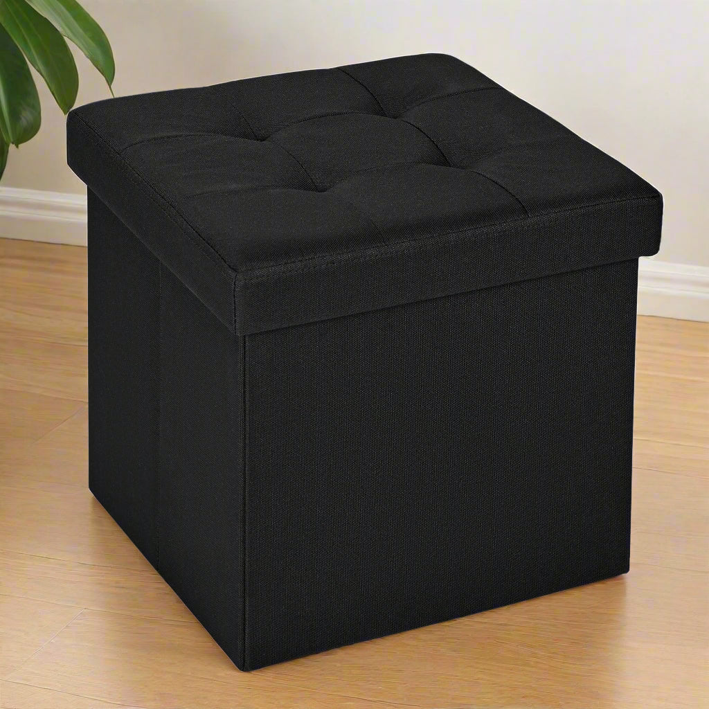 Small black foldable storage ottoman cube with lid
Tufted black ottoman seat with internal hidden storage
Collapsible fabric storage cube for bedrooms and entryways