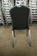 Stackable Banquet Chair – Black Dot Upholstery – Angled Front

Banquet Chairs in Row – Side View

Black Event Chairs in Use at Corporate Event

Commercial Banquet Seating – Stackable Design