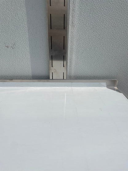 Stainless steel wall-mounted shelf front view

Close-up of shelf bracket and mounting

Side view of stainless steel shelf over prep station

Commercial wall shelf above kitchen counter

Single-tier wall shelf with polished finish