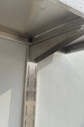 Stainless steel wall-mounted shelf front view

Close-up of shelf bracket and mounting

Side view of stainless steel shelf over prep station

Commercial wall shelf above kitchen counter

Single-tier wall shelf with polished finish