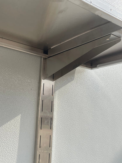 Stainless steel wall-mounted shelf front view

Close-up of shelf bracket and mounting

Side view of stainless steel shelf over prep station

Commercial wall shelf above kitchen counter

Single-tier wall shelf with polished finish