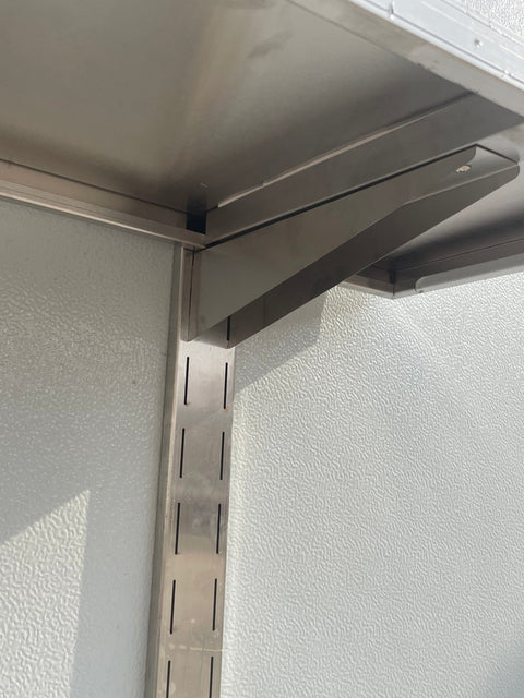 Stainless steel wall-mounted shelf front view

Close-up of shelf bracket and mounting

Side view of stainless steel shelf over prep station

Commercial wall shelf above kitchen counter

Single-tier wall shelf with polished finish