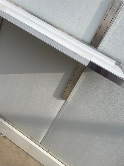 Stainless steel wall-mounted shelf front view

Close-up of shelf bracket and mounting

Side view of stainless steel shelf over prep station

Commercial wall shelf above kitchen counter

Single-tier wall shelf with polished finish