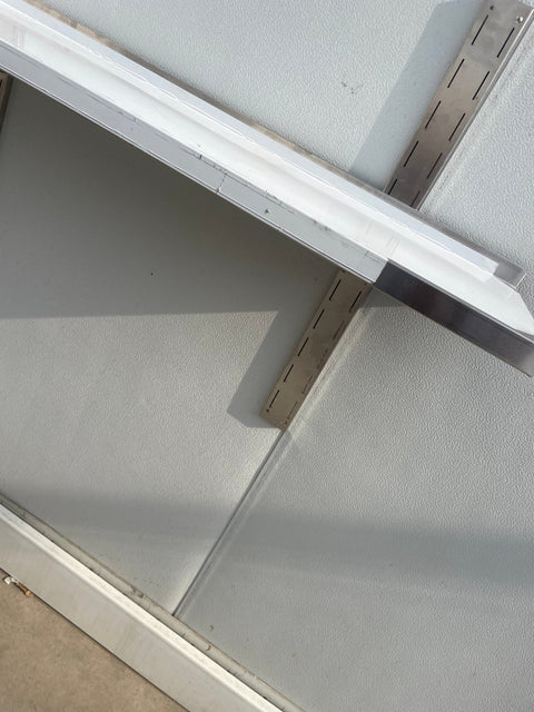 Stainless steel wall-mounted shelf front view

Close-up of shelf bracket and mounting

Side view of stainless steel shelf over prep station

Commercial wall shelf above kitchen counter

Single-tier wall shelf with polished finish