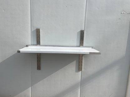 Stainless steel wall-mounted shelf front view

Close-up of shelf bracket and mounting

Side view of stainless steel shelf over prep station

Commercial wall shelf above kitchen counter

Single-tier wall shelf with polished finish