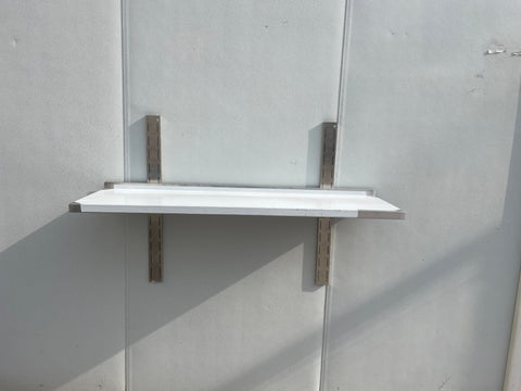 Stainless steel wall-mounted shelf front view

Close-up of shelf bracket and mounting

Side view of stainless steel shelf over prep station

Commercial wall shelf above kitchen counter

Single-tier wall shelf with polished finish