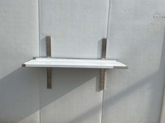 Stainless steel wall-mounted shelf front view

Close-up of shelf bracket and mounting

Side view of stainless steel shelf over prep station

Commercial wall shelf above kitchen counter

Single-tier wall shelf with polished finish