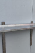 Stainless steel wall-mounted shelf front view

Close-up of shelf bracket and mounting

Side view of stainless steel shelf over prep station

Commercial wall shelf above kitchen counter

Single-tier wall shelf with polished finish