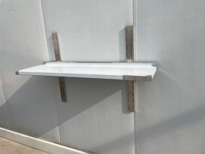 Stainless steel wall-mounted shelf front view

Close-up of shelf bracket and mounting

Side view of stainless steel shelf over prep station

Commercial wall shelf above kitchen counter

Single-tier wall shelf with polished finish