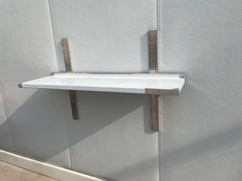 Stainless steel wall-mounted shelf front view

Close-up of shelf bracket and mounting

Side view of stainless steel shelf over prep station

Commercial wall shelf above kitchen counter

Single-tier wall shelf with polished finish