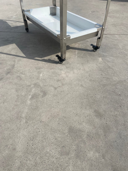 Stainless steel 3-tier kitchen trolley cart front view

Rolling utility shelf for commercial kitchens

3-shelf stainless steel transport cart with wheels

Commercial-grade stainless steel mobile cart

Trolley with locking caster wheels for food service