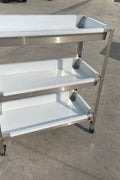 Stainless steel 3-tier kitchen trolley cart front view

Rolling utility shelf for commercial kitchens

3-shelf stainless steel transport cart with wheels

Commercial-grade stainless steel mobile cart

Trolley with locking caster wheels for food service