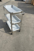 Stainless steel 3-tier kitchen trolley cart front view

Rolling utility shelf for commercial kitchens

3-shelf stainless steel transport cart with wheels

Commercial-grade stainless steel mobile cart

Trolley with locking caster wheels for food service