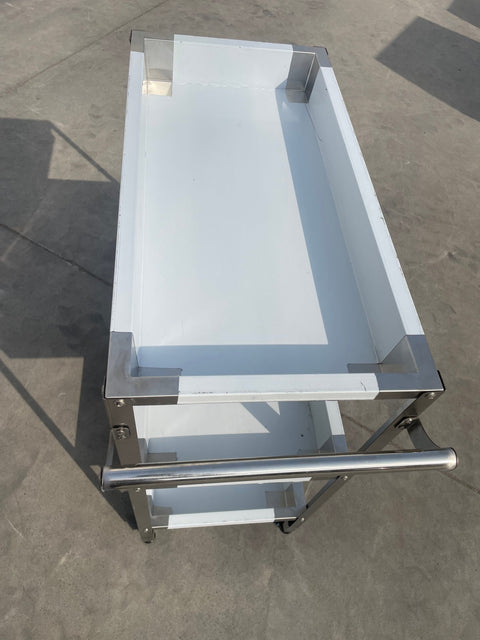 Stainless steel 3-tier kitchen trolley cart front view

Rolling utility shelf for commercial kitchens

3-shelf stainless steel transport cart with wheels

Commercial-grade stainless steel mobile cart

Trolley with locking caster wheels for food service