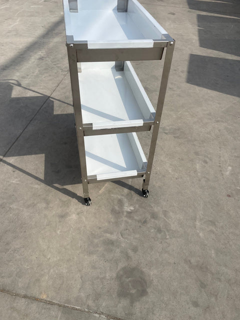 Stainless steel 3-tier kitchen trolley cart front view

Rolling utility shelf for commercial kitchens

3-shelf stainless steel transport cart with wheels

Commercial-grade stainless steel mobile cart

Trolley with locking caster wheels for food service