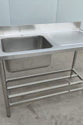 Stainless steel sink with right drainboard and backsplash

Freestanding commercial sink for food prep

Single bowl kitchen sink with undershelf

Heavy-duty stainless sink station front view

Restaurant-grade sink unit with drainboard
