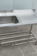 Stainless steel sink with right drainboard and backsplash

Freestanding commercial sink for food prep

Single bowl kitchen sink with undershelf

Heavy-duty stainless sink station front view

Restaurant-grade sink unit with drainboard