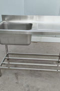 Stainless steel sink with right drainboard and backsplash

Freestanding commercial sink for food prep

Single bowl kitchen sink with undershelf

Heavy-duty stainless sink station front view

Restaurant-grade sink unit with drainboard
