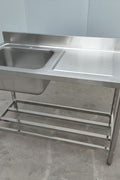 Stainless steel sink with right drainboard and backsplash

Freestanding commercial sink for food prep

Single bowl kitchen sink with undershelf

Heavy-duty stainless sink station front view

Restaurant-grade sink unit with drainboard