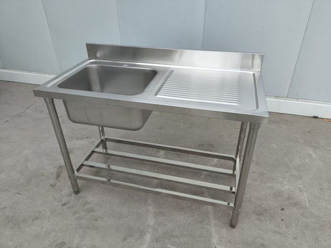 Stainless steel sink with right drainboard and backsplash

Freestanding commercial sink for food prep

Single bowl kitchen sink with undershelf

Heavy-duty stainless sink station front view

Restaurant-grade sink unit with drainboard