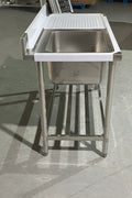 Stainless steel sink with right drainboard and backsplash

Freestanding commercial sink for food prep

Single bowl kitchen sink with undershelf

Heavy-duty stainless sink station front view

Restaurant-grade sink unit with drainboard
