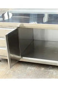 Stainless steel cabinet table front view

Industrial workbench with drawers and soft-close doors

Side angle of stainless steel garage workstation