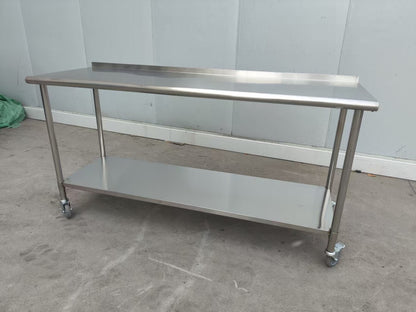 Stainless steel rolling work table with locking wheels – front view

48-inch stainless steel prep station with under-shelf and casters

72-inch commercial kitchen table with wheels – side angle

Mobile food service prep table with heavy-duty design

Industrial stainless table in warehouse environment