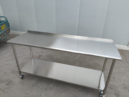 Stainless steel rolling work table with locking wheels – front view

48-inch stainless steel prep station with under-shelf and casters

72-inch commercial kitchen table with wheels – side angle

Mobile food service prep table with heavy-duty design

Industrial stainless table in warehouse environment