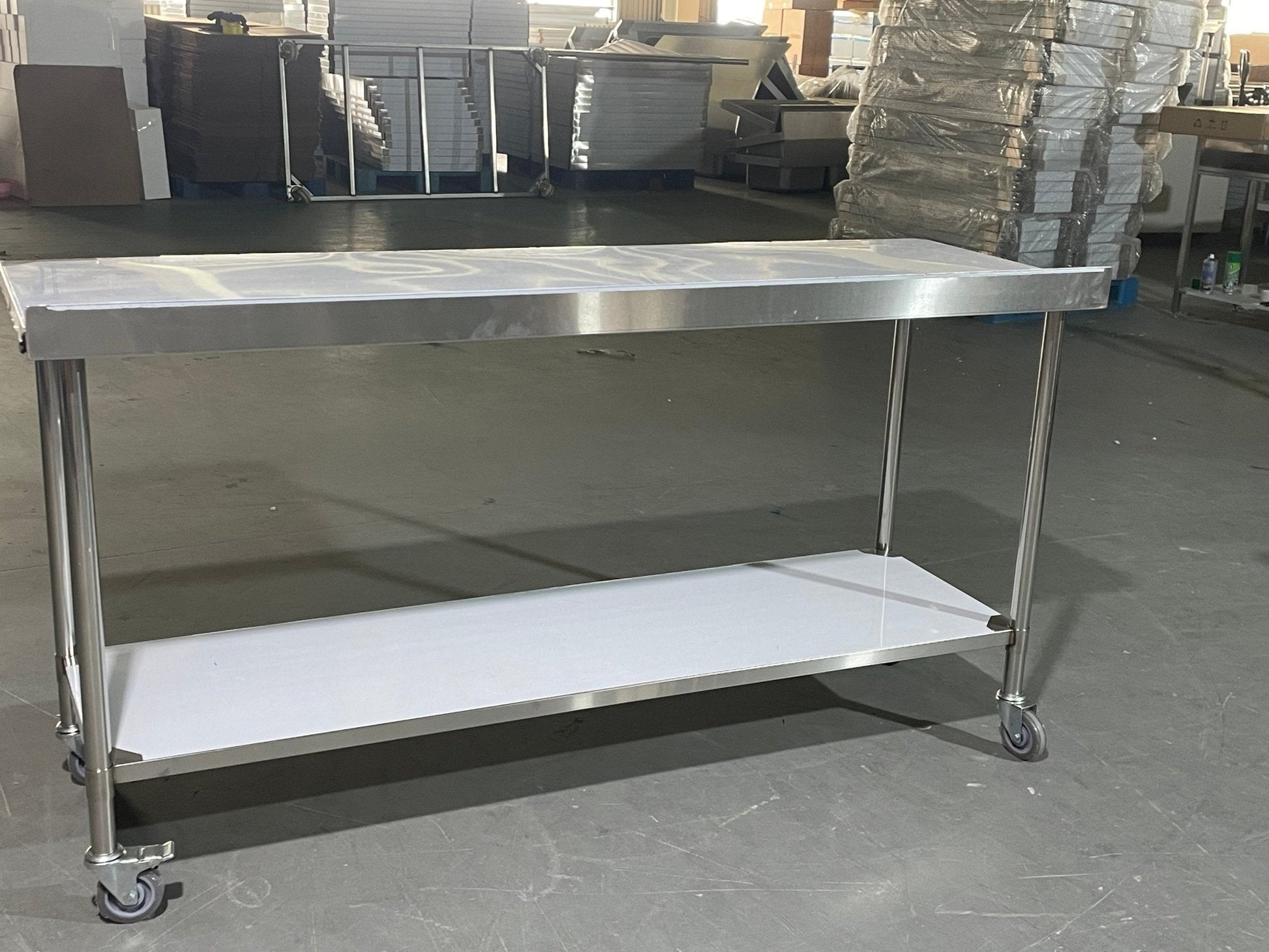 Stainless steel rolling work table with locking wheels – front view

48-inch stainless steel prep station with under-shelf and casters

72-inch commercial kitchen table with wheels – side angle

Mobile food service prep table with heavy-duty design

Industrial stainless table in warehouse environment