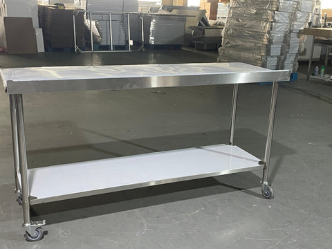 Stainless steel rolling work table with locking wheels – front view

48-inch stainless steel prep station with under-shelf and casters

72-inch commercial kitchen table with wheels – side angle

Mobile food service prep table with heavy-duty design

Industrial stainless table in warehouse environment
