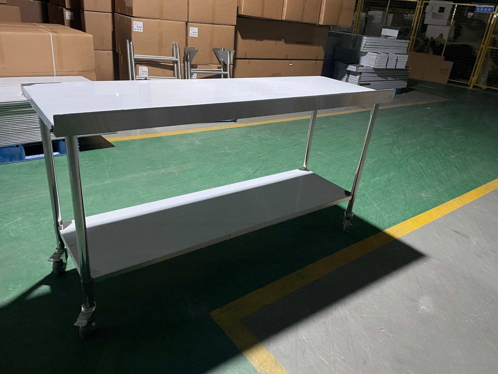 Stainless steel rolling work table with locking wheels – front view

48-inch stainless steel prep station with under-shelf and casters

72-inch commercial kitchen table with wheels – side angle

Mobile food service prep table with heavy-duty design

Industrial stainless table in warehouse environment