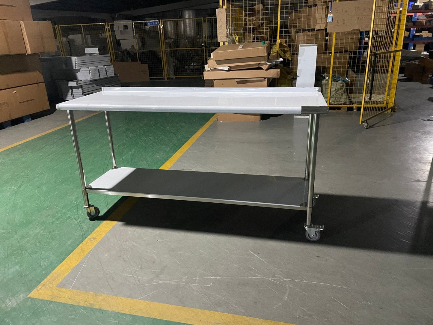 Stainless steel rolling work table with locking wheels – front view

48-inch stainless steel prep station with under-shelf and casters

72-inch commercial kitchen table with wheels – side angle

Mobile food service prep table with heavy-duty design

Industrial stainless table in warehouse environment