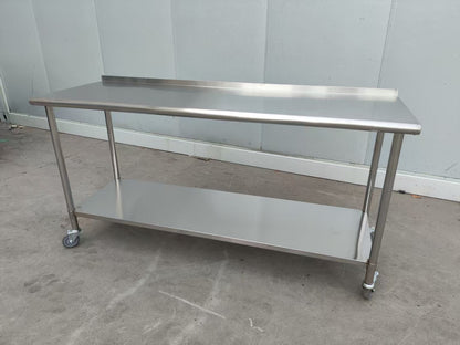 Stainless steel rolling work table with locking wheels – front view

48-inch stainless steel prep station with under-shelf and casters

72-inch commercial kitchen table with wheels – side angle

Mobile food service prep table with heavy-duty design

Industrial stainless table in warehouse environment