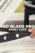 “Commercial stainless steel rocker pizza cutter with black handle”

“Rocker pizza blade with protective sheath”

“Professional pizza slicer on kitchen counter”