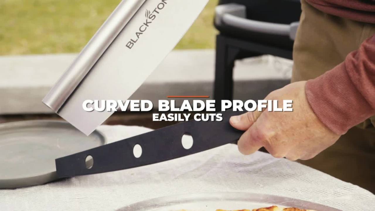 “Commercial stainless steel rocker pizza cutter with black handle”

“Rocker pizza blade with protective sheath”

“Professional pizza slicer on kitchen counter”