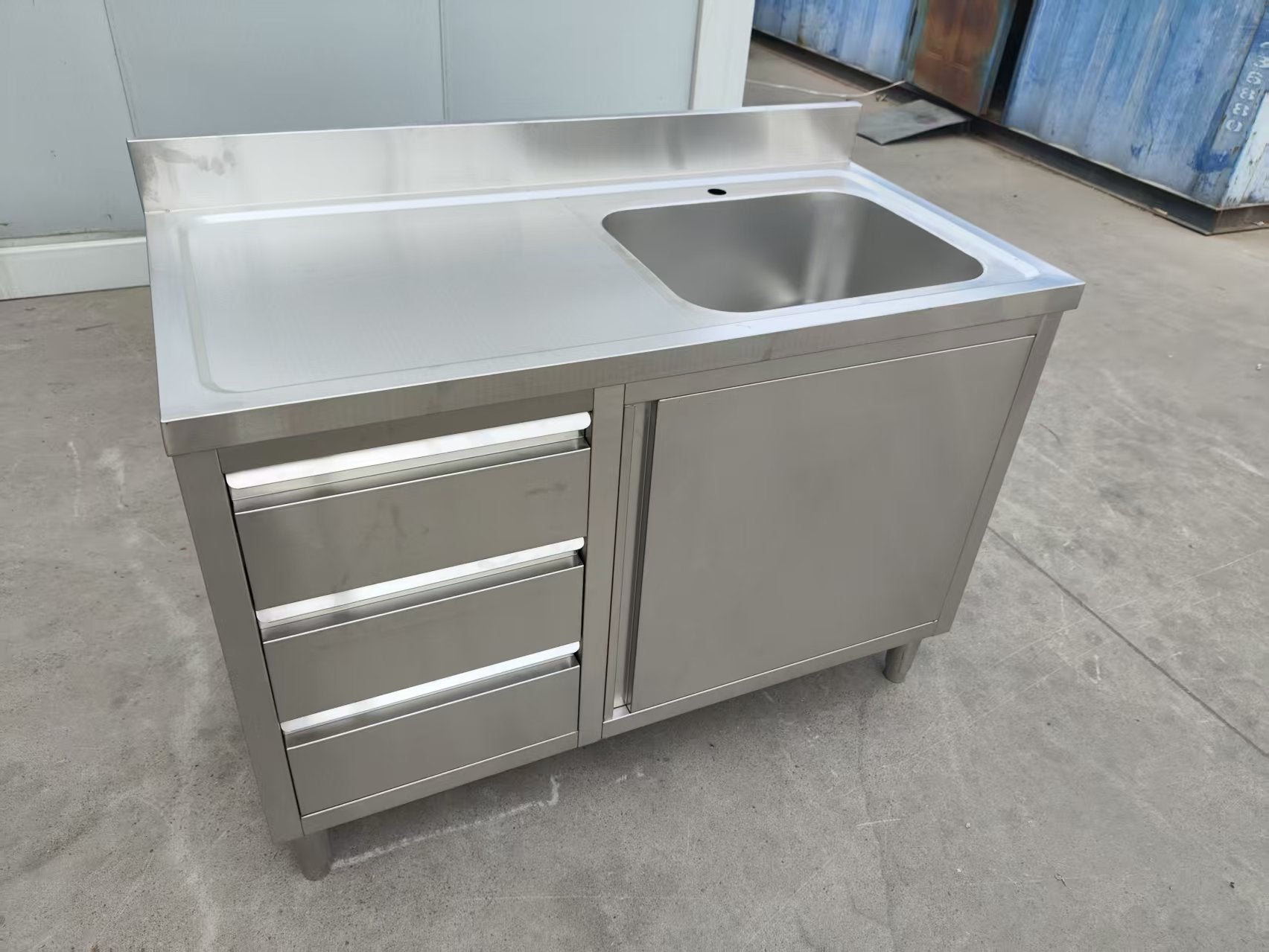 Stainless steel utility sink with 3 drawers front view

Commercial sink cabinet for restaurant or kitchen use

Stainless sink station with pull-out storage drawers

Industrial-grade sink unit with integrated storage

Compact kitchen sink workstation for food prep areas
