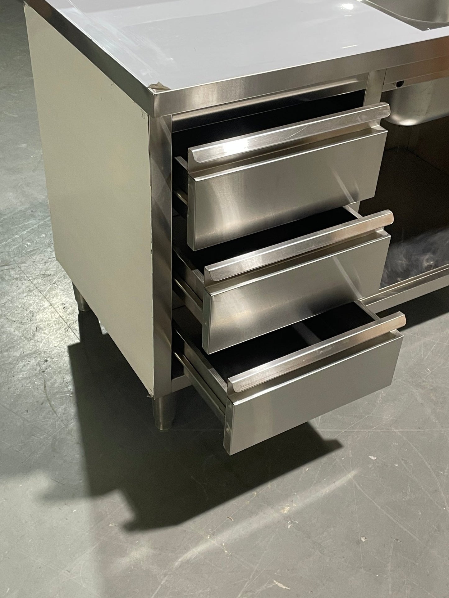 Stainless steel utility sink with 3 drawers front view

Commercial sink cabinet for restaurant or kitchen use

Stainless sink station with pull-out storage drawers

Industrial-grade sink unit with integrated storage

Compact kitchen sink workstation for food prep areas