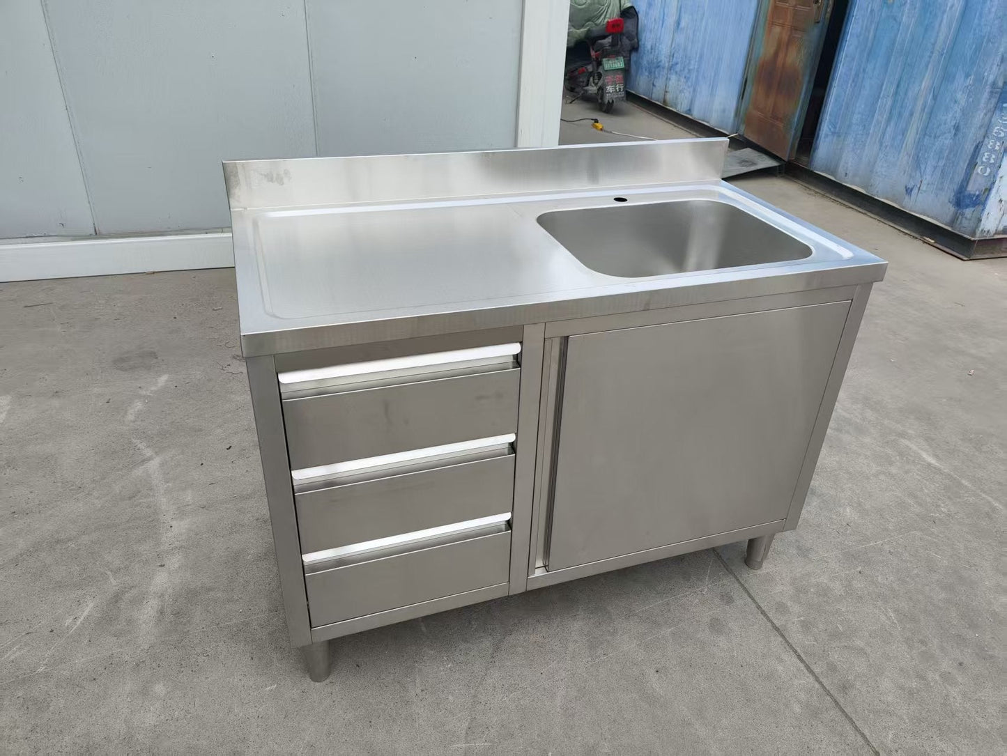 Stainless steel utility sink with 3 drawers front view

Commercial sink cabinet for restaurant or kitchen use

Stainless sink station with pull-out storage drawers

Industrial-grade sink unit with integrated storage

Compact kitchen sink workstation for food prep areas