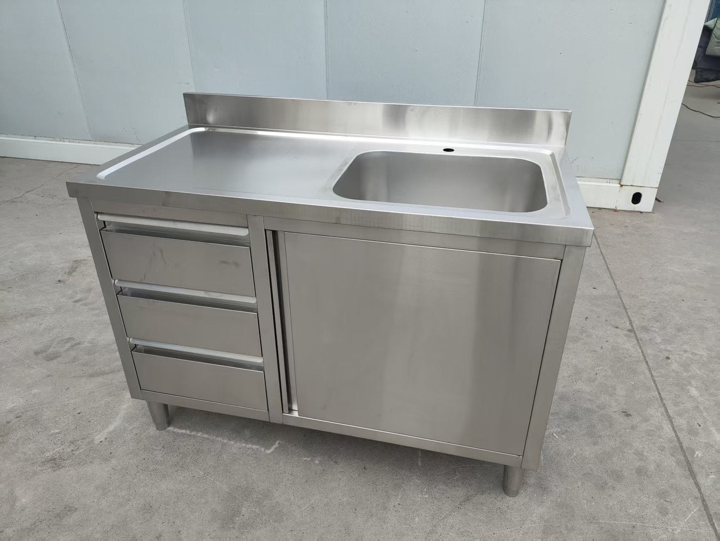 Stainless steel utility sink with 3 drawers front view

Commercial sink cabinet for restaurant or kitchen use

Stainless sink station with pull-out storage drawers

Industrial-grade sink unit with integrated storage

Compact kitchen sink workstation for food prep areas