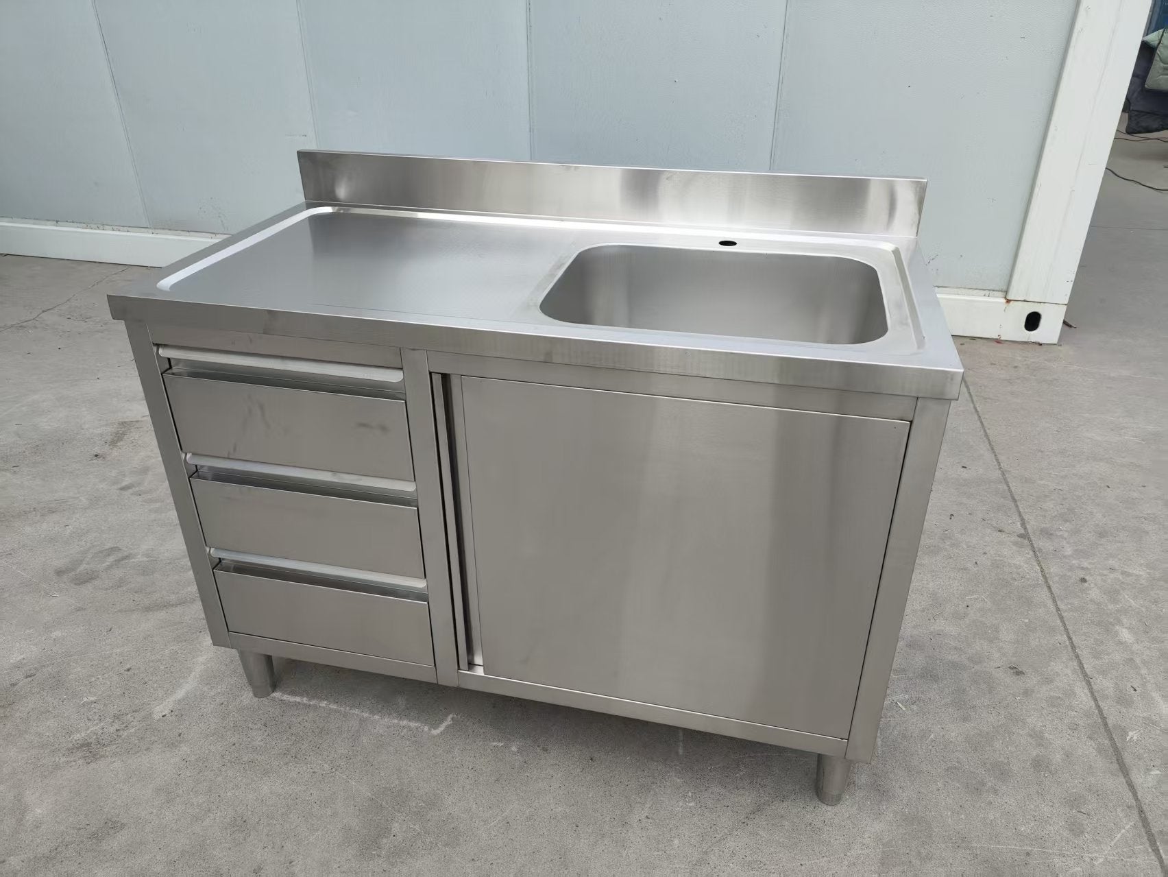 Stainless steel utility sink with 3 drawers front view

Commercial sink cabinet for restaurant or kitchen use

Stainless sink station with pull-out storage drawers

Industrial-grade sink unit with integrated storage

Compact kitchen sink workstation for food prep areas