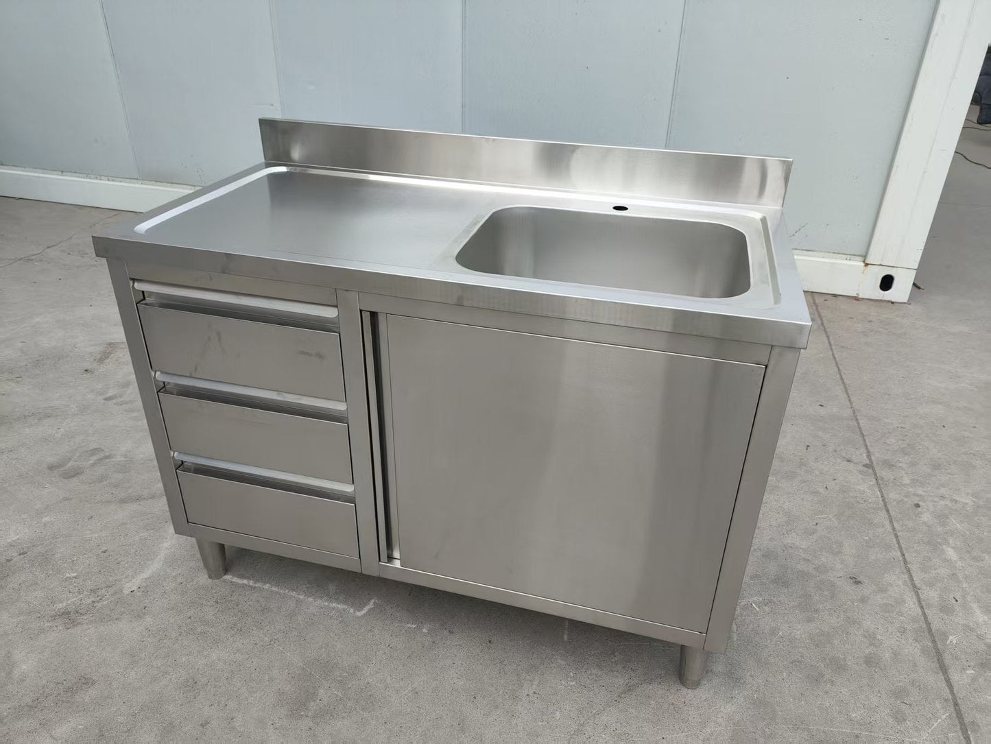 Stainless steel utility sink with 3 drawers front view

Commercial sink cabinet for restaurant or kitchen use

Stainless sink station with pull-out storage drawers

Industrial-grade sink unit with integrated storage

Compact kitchen sink workstation for food prep areas